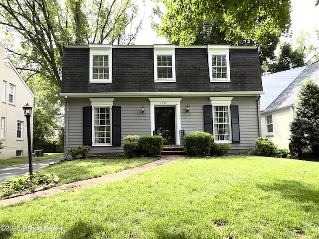 3920 Elfin Ave, Louisville, KY 40207 - view of front of home featuring mansard roof, roof with shingles, a front yard, and cooling unit