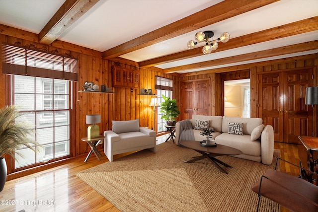 3920 Elfin Ave, Louisville, KY 40207 - living area with wood walls, beamed ceiling, and wood finished floors