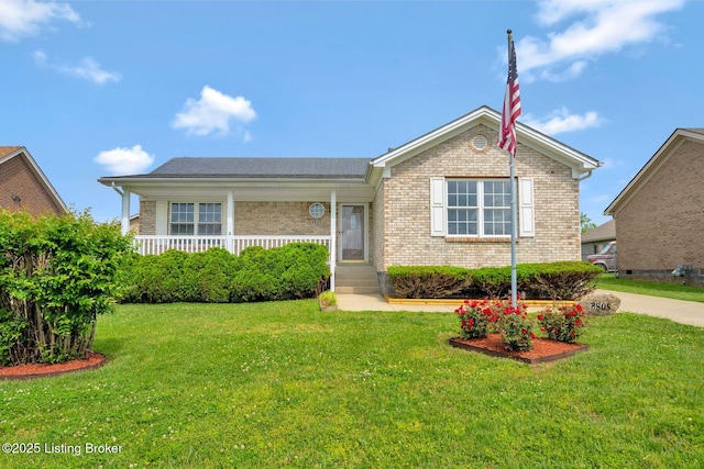 8805 Wisdom Ln, Louisville, KY 40229 - view of front of house with brick siding, a front lawn, and covered porch