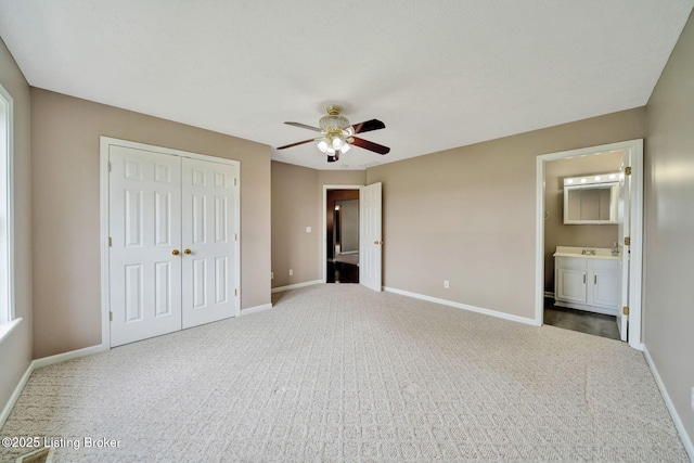 8805 Wisdom Ln, Louisville, KY 40229 - unfurnished bedroom featuring carpet, a closet, and baseboards