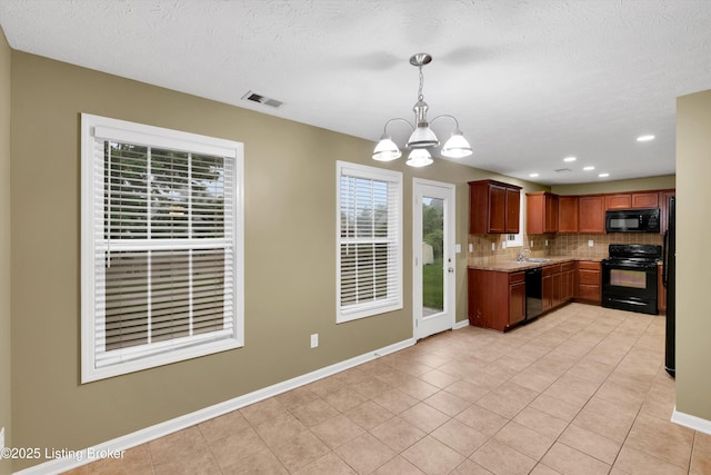 8712 Chetwood Trace Dr, Louisville, KY 40291 - kitchen featuring black appliances, a sink, a chandelier, backsplash, and light tile patterned floors