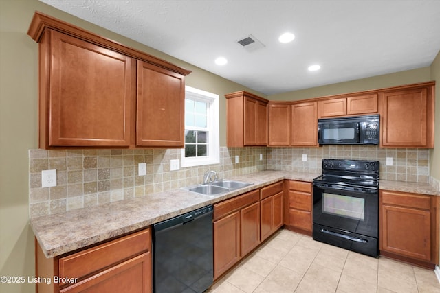 8712 Chetwood Trace Dr, Louisville, KY 40291 - kitchen featuring black appliances, a sink, light countertops, brown cabinetry, and recessed lighting