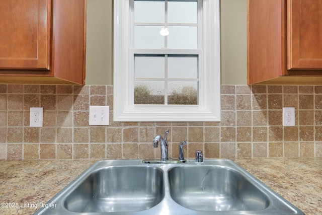 8712 Chetwood Trace Dr, Louisville, KY 40291 - kitchen view of a sink, backsplash, and brown cabinetry