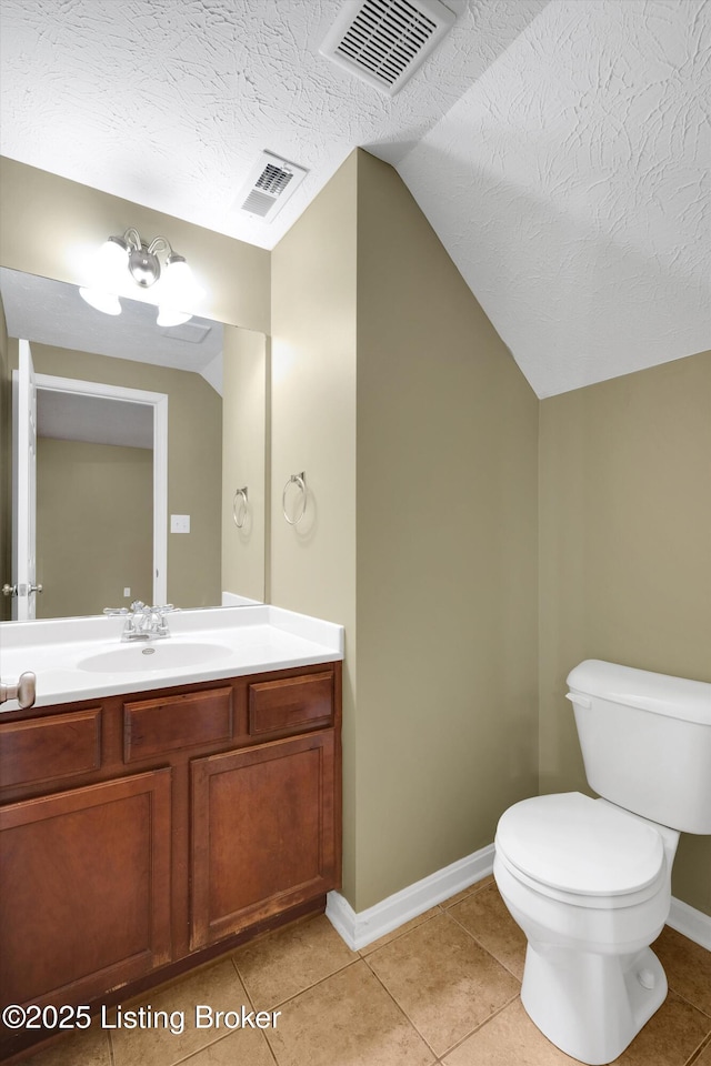 8712 Chetwood Trace Dr, Louisville, KY 40291 - half bathroom with lofted ceiling, toilet, vanity, baseboards, and tile patterned flooring