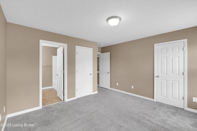8712 Chetwood Trace Dr, Louisville, KY 40291 - unfurnished bedroom with carpet flooring, baseboards, and ensuite bath