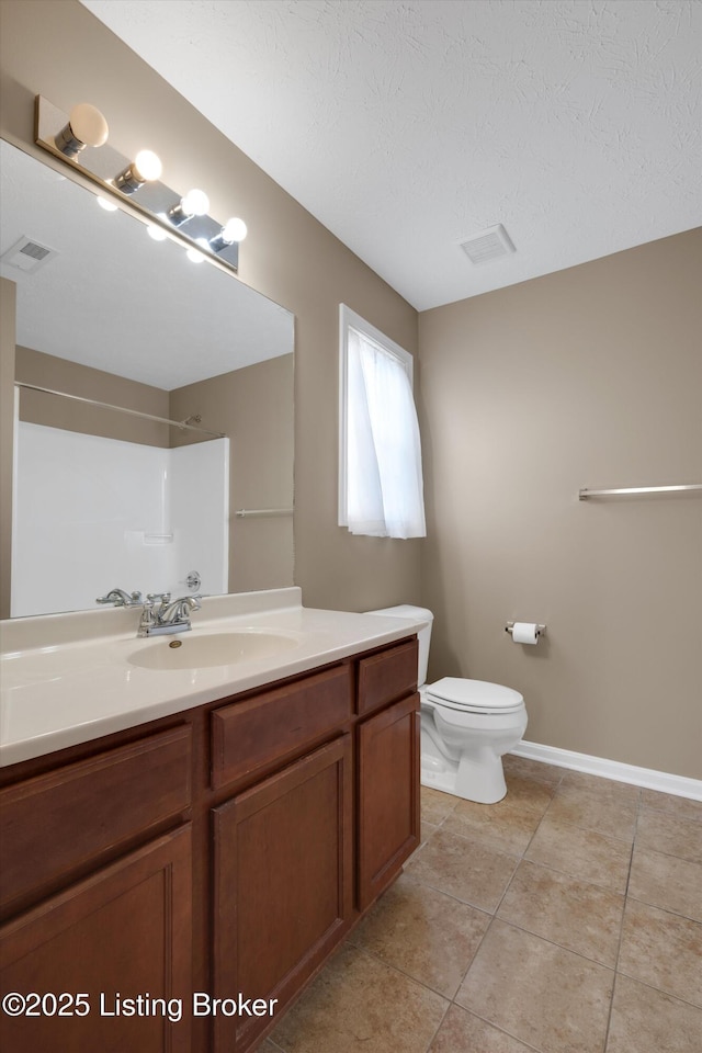 8712 Chetwood Trace Dr, Louisville, KY 40291 - bathroom with vanity, a shower, toilet, tile patterned floors, and a textured ceiling