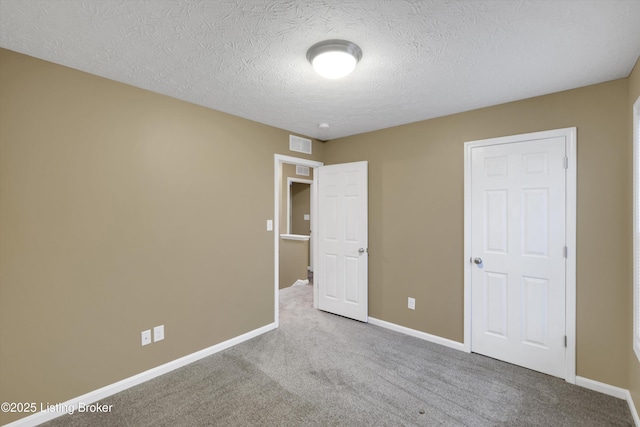 8712 Chetwood Trace Dr, Louisville, KY 40291 - unfurnished bedroom featuring carpet, baseboards, and a textured ceiling