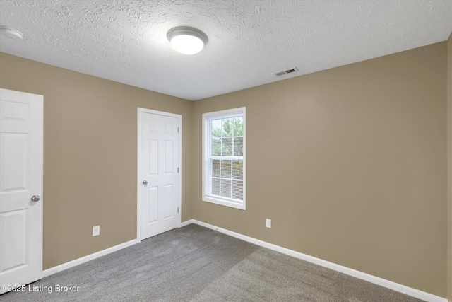 8712 Chetwood Trace Dr, Louisville, KY 40291 - unfurnished bedroom featuring dark carpet, baseboards, and a textured ceiling