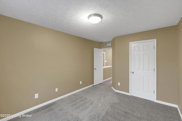 8712 Chetwood Trace Dr, Louisville, KY 40291 - unfurnished bedroom with baseboards, a textured ceiling, and carpet