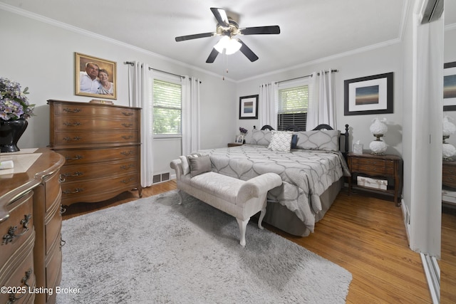 5506 Bamberrie Cross Rd, Louisville, KY 40214 - bedroom featuring multiple windows, ornamental molding, light wood-type flooring, and ceiling fan
