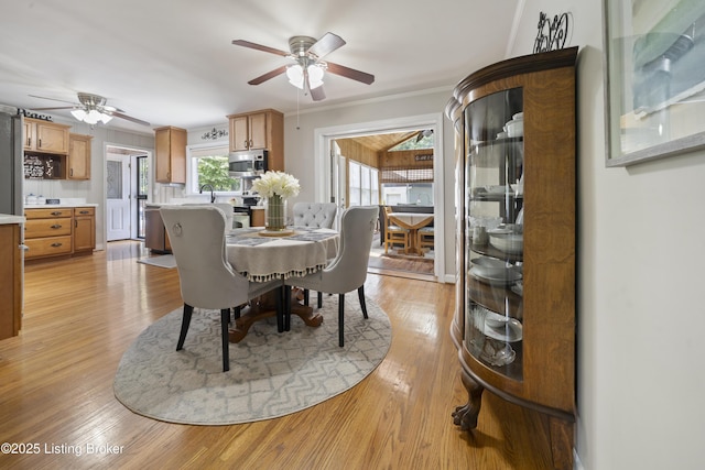 5506 Bamberrie Cross Rd, Louisville, KY 40214 - dining room with a ceiling fan and light wood-style floors