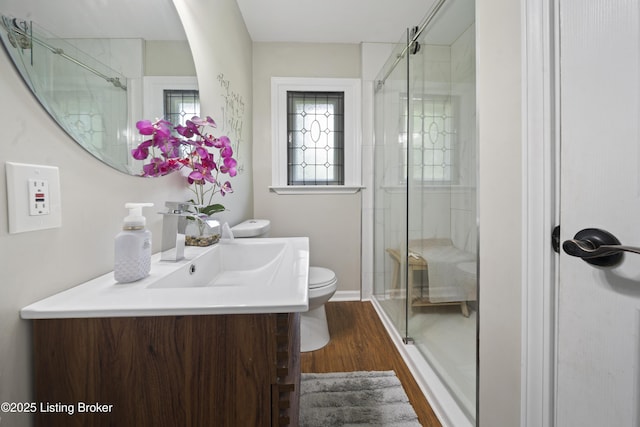 5506 Bamberrie Cross Rd, Louisville, KY 40214 - bathroom with toilet, wood finished floors, a shower stall, and vanity
