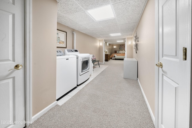 5506 Bamberrie Cross Rd, Louisville, KY 40214 - laundry area featuring washer and clothes dryer, light colored carpet, and baseboards