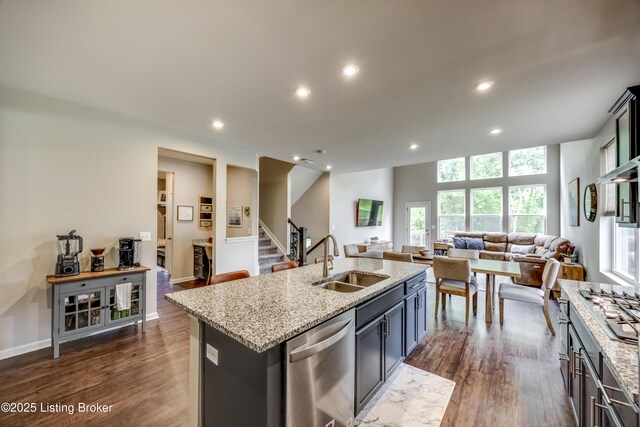 3928 Creek Meadow Dr, La Grange, KY 40031 - kitchen featuring a sink, stainless steel dishwasher, open floor plan, a kitchen island with sink, and dark wood-style floors