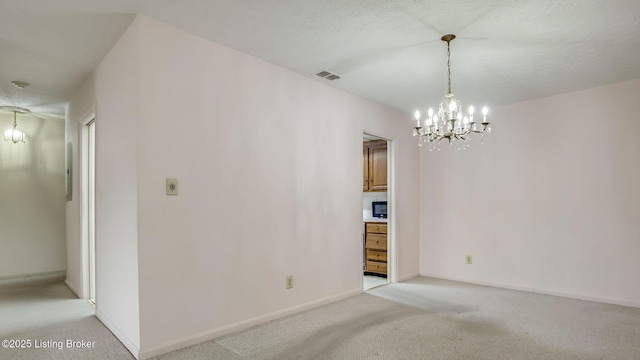 3030 Breckenridge Ln Unit 108, Louisville, KY 40220 - unfurnished room with a chandelier, light colored carpet, and baseboards