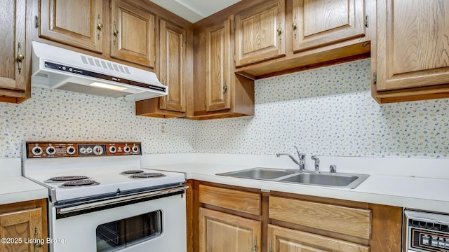 3030 Breckenridge Ln Unit 108, Louisville, KY 40220 - kitchen featuring electric stove, under cabinet range hood, a sink, and light countertops
