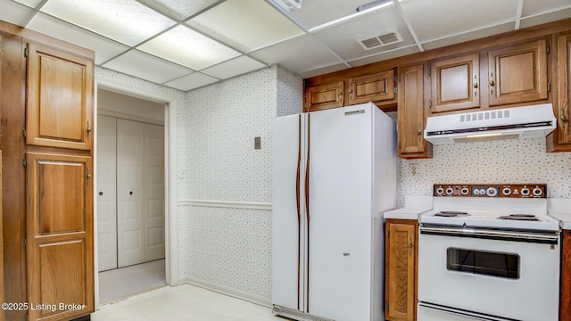 3030 Breckenridge Ln Unit 108, Louisville, KY 40220 - kitchen featuring extractor fan, white appliances, wallpapered walls, light countertops, and brown cabinetry