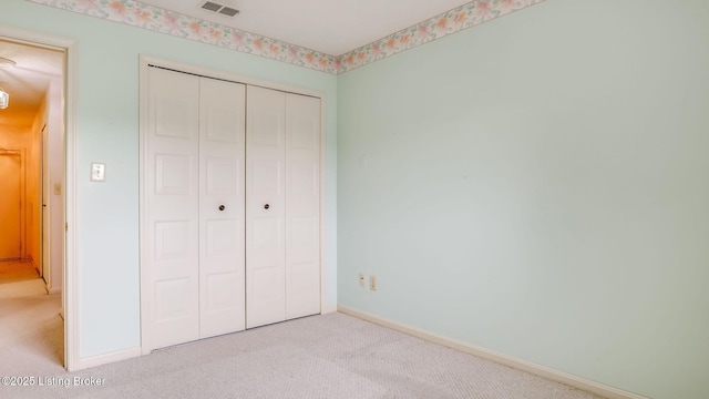 3030 Breckenridge Ln Unit 108, Louisville, KY 40220 - unfurnished bedroom with light carpet, a closet, and baseboards