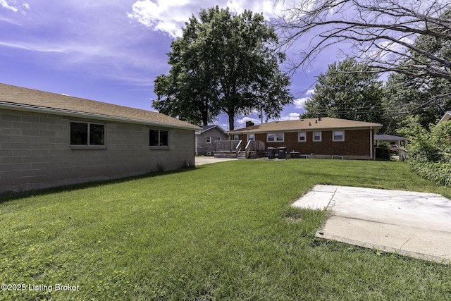 7407 Beahl Blvd, Louisville, KY 40258 - view of grassy yard featuring a patio