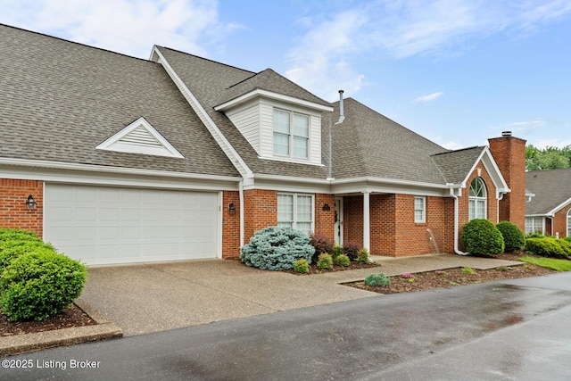 10431 Monticello Forest Cir, Jeffersontown, KY 40299 - view of front facade featuring concrete driveway, roof with shingles, brick siding, a garage, and a chimney