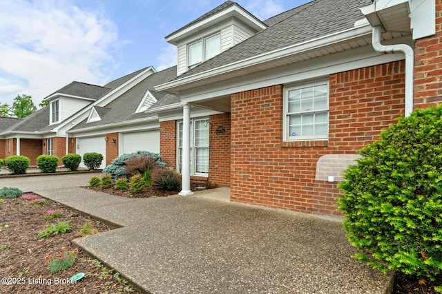 10431 Monticello Forest Cir, Jeffersontown, KY 40299 - view of front of property with a garage, brick siding, driveway, and roof with shingles