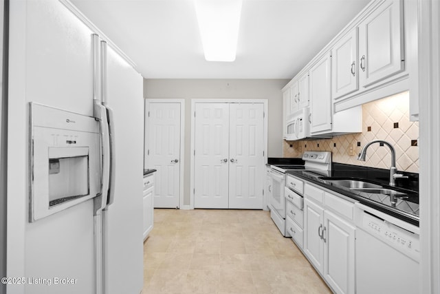 10431 Monticello Forest Cir, Jeffersontown, KY 40299 - kitchen with white appliances, a sink, dark countertops, and white cabinetry