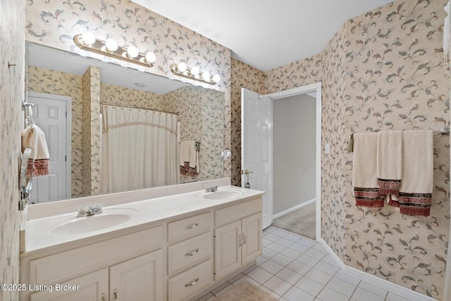 10431 Monticello Forest Cir, Jeffersontown, KY 40299 - bathroom featuring tile patterned floors, wallpapered walls, double vanity, and baseboards
