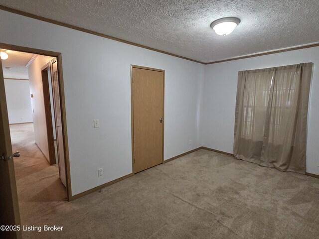 15008 Galston Blvd, Louisville, KY 40272 - unfurnished bedroom with carpet, crown molding, a textured ceiling, and baseboards