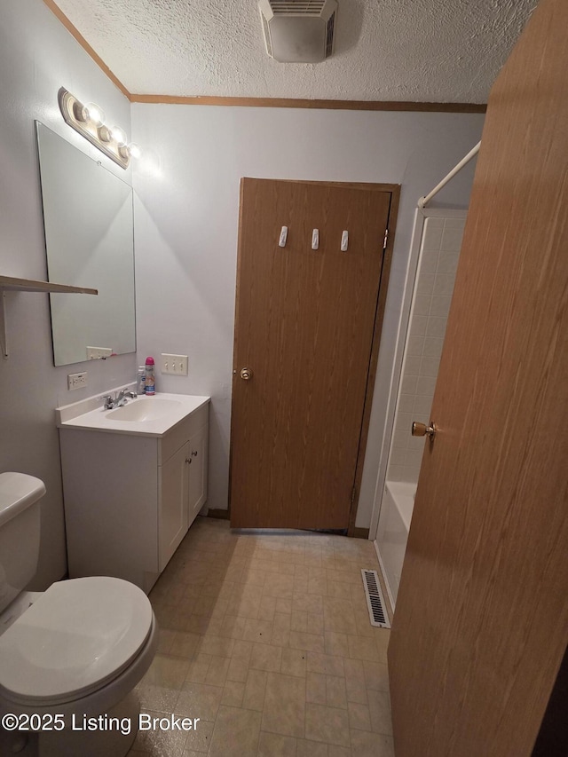 15008 Galston Blvd, Louisville, KY 40272 - full bath featuring a textured ceiling, toilet, vanity, tile patterned floors, and shower / bathtub combination