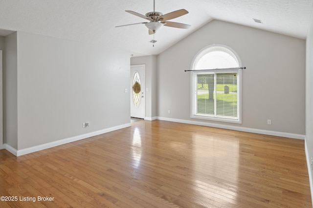 1020 Polley Dr, Bardstown, KY 40004 - unfurnished living room featuring a ceiling fan, light wood finished floors, vaulted ceiling, and baseboards