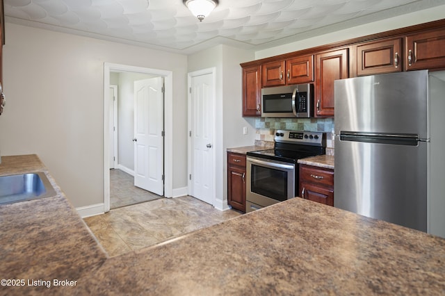 1020 Polley Dr, Bardstown, KY 40004 - kitchen with appliances with stainless steel finishes, decorative backsplash, baseboards, a sink, and dark countertops