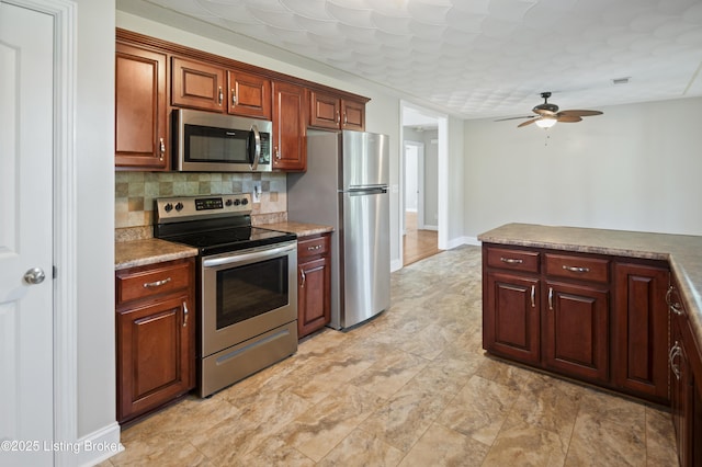 1020 Polley Dr, Bardstown, KY 40004 - kitchen with stainless steel appliances, ceiling fan, and decorative backsplash