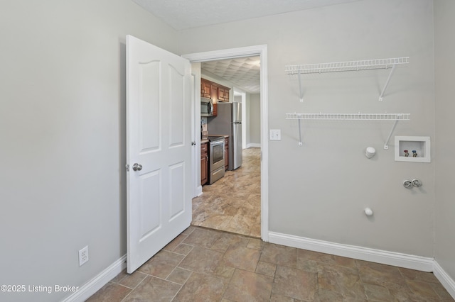 1020 Polley Dr, Bardstown, KY 40004 - washroom with hookup for a gas dryer, baseboards, washer hookup, and stone finish floors