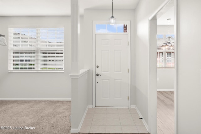 5010 Cotehele Pl, Louisville, KY 40241 - entrance foyer with baseboards, light tile patterned flooring, and a chandelier