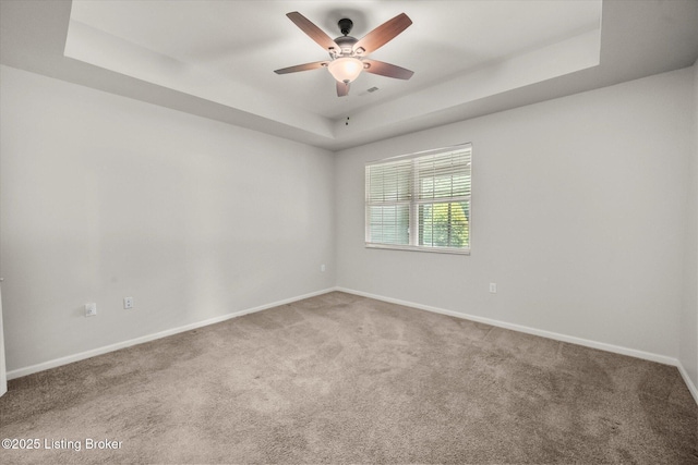 5010 Cotehele Pl, Louisville, KY 40241 - carpeted spare room with a tray ceiling, a ceiling fan, and baseboards