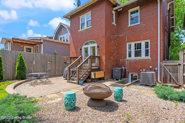 2220 Alta Ave, Louisville, KY 40205 - back of house featuring brick siding, cooling unit, a patio, and a gate