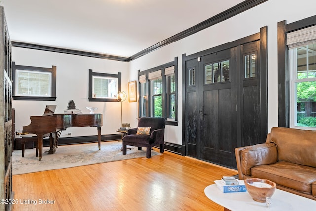 2220 Alta Ave, Louisville, KY 40205 - entrance foyer featuring light wood-style floors, crown molding, and a baseboard radiator