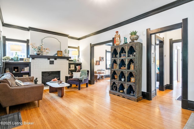 2220 Alta Ave, Louisville, KY 40205 - living room with ornamental molding, light wood-type flooring, and a fireplace