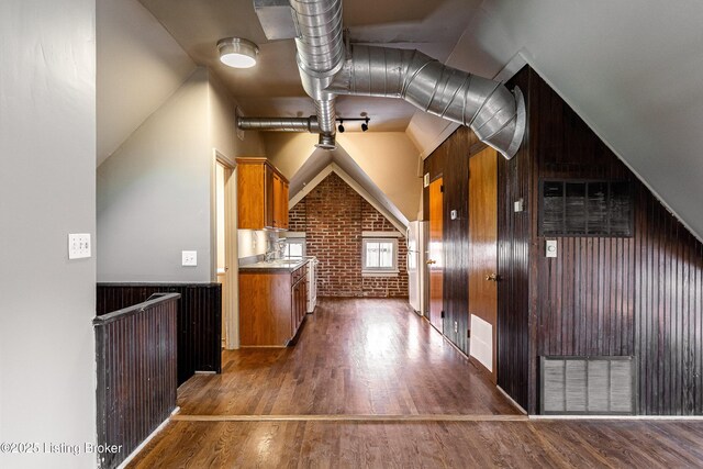 211 Haldeman Ave, Louisville, KY 40206 - bonus room featuring dark wood finished floors, brick wall, wood walls, and vaulted ceiling