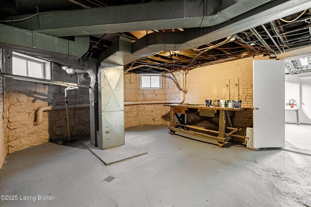 211 Haldeman Ave, Louisville, KY 40206 - basement with a workshop area and heating unit