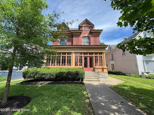 211 Haldeman Ave, Louisville, KY 40206 - view of front of house with brick siding, a front yard, and french doors