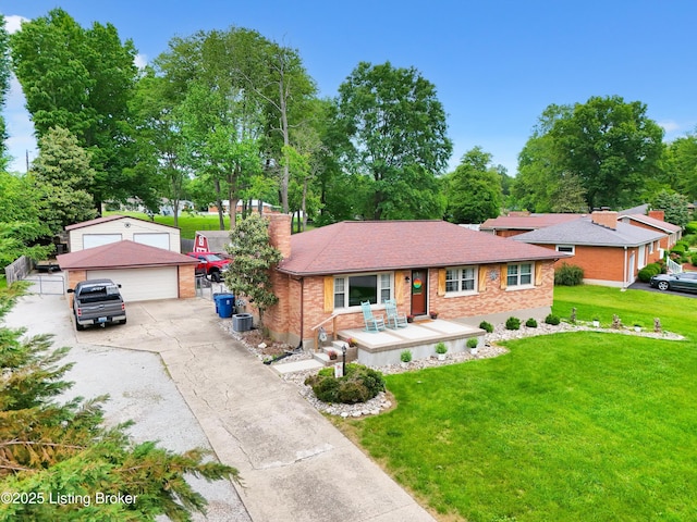 9926 Silverwood Ln, Louisville, KY 40272 - single story home featuring an outdoor structure, a detached garage, a chimney, a front yard, and brick siding