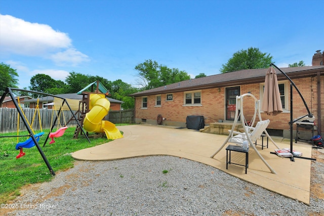 9926 Silverwood Ln, Louisville, KY 40272 - back of house featuring brick siding, a playground, a patio area, and a chimney