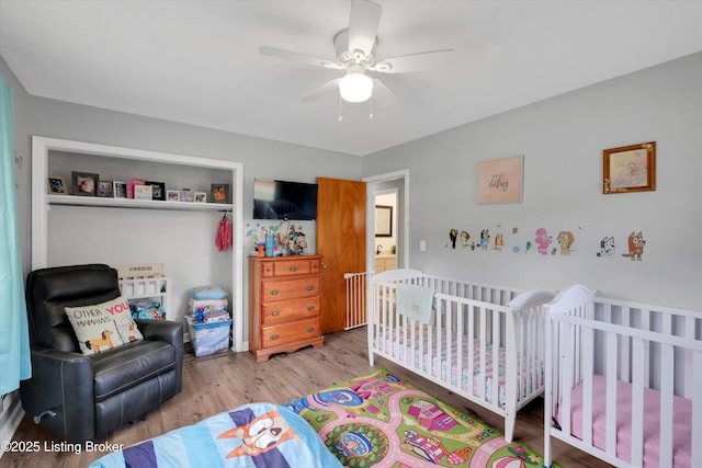 9926 Silverwood Ln, Louisville, KY 40272 - bedroom with wood finished floors, ceiling fan, and a nursery area