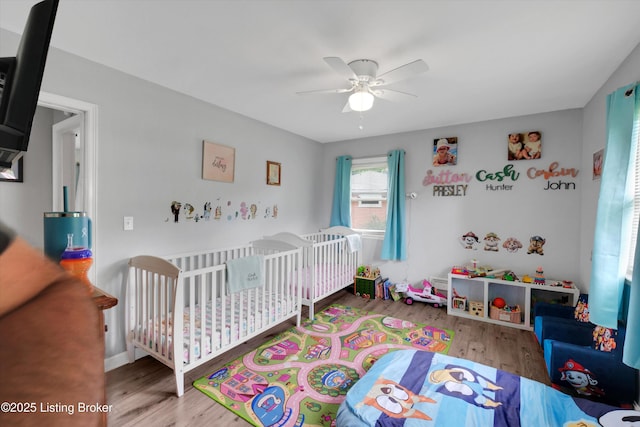 9926 Silverwood Ln, Louisville, KY 40272 - bedroom with wood finished floors, a nursery area, and a ceiling fan