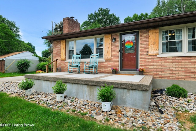 9926 Silverwood Ln, Louisville, KY 40272 - view of front of property featuring brick siding and a chimney