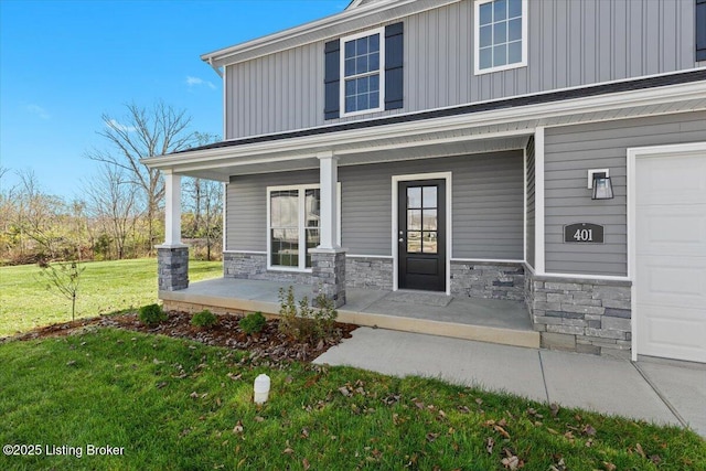 401 Sandy Cir, Elizabethtown, KY 42701 - entrance to property featuring a porch, board and batten siding, stone siding, a lawn, and a garage