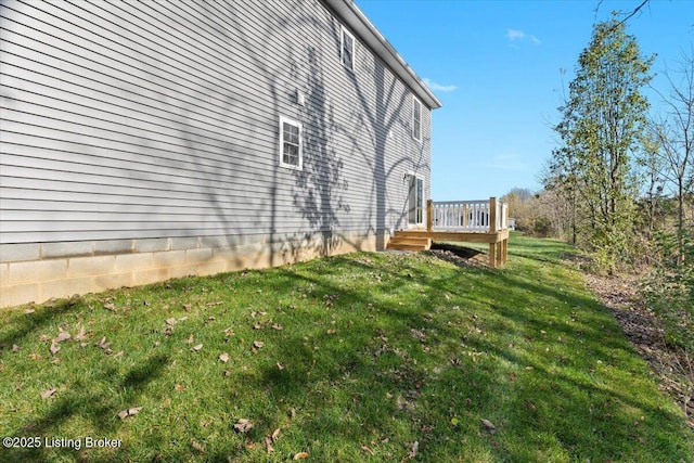 401 Sandy Cir, Elizabethtown, KY 42701 - view of home's exterior featuring a lawn and a deck