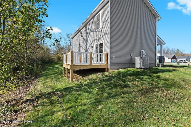 401 Sandy Cir, Elizabethtown, KY 42701 - view of home's exterior with a deck, central AC, and a yard