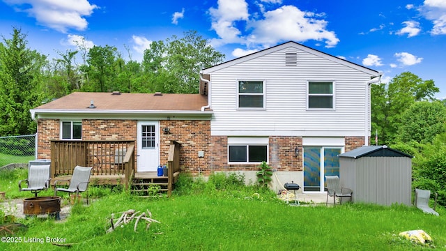 7333 W Orchard Grass Blvd, Crestwood, KY 40014 - rear view of house with an outdoor fire pit, brick siding, a deck, central AC unit, and fence